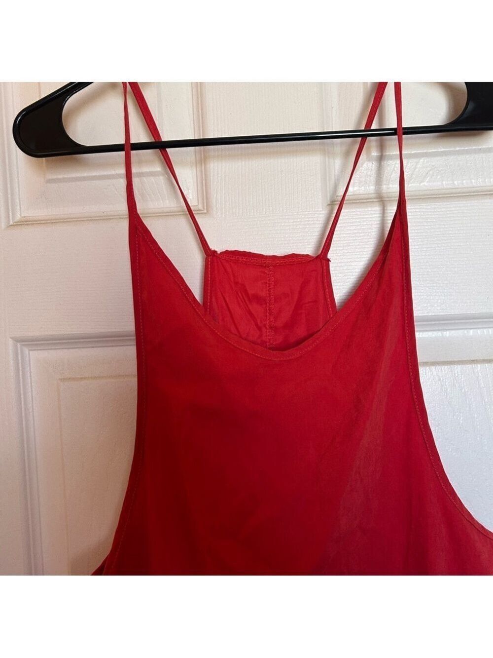 One piece red toned jumpsuit. Material soft and comfortable- not stretchy